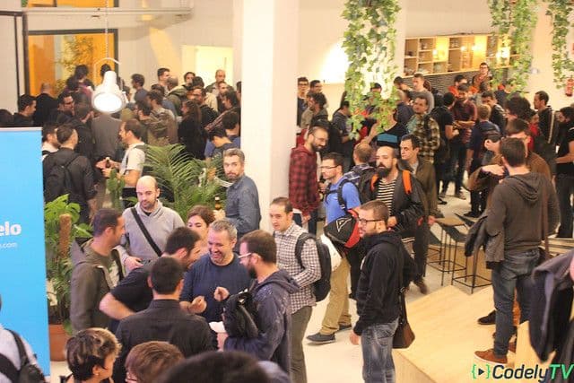 Audience standing and talking among themselves